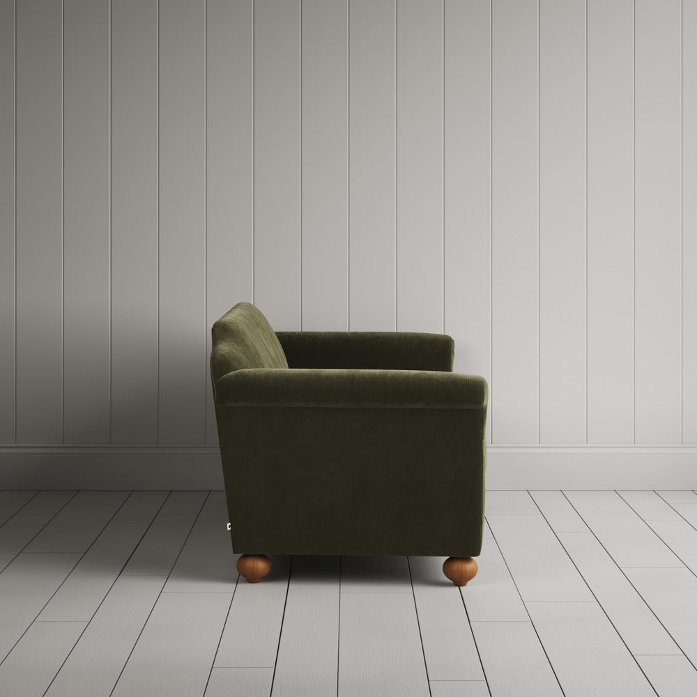 Side profile of the Caper green corduroy Dolittle sofa