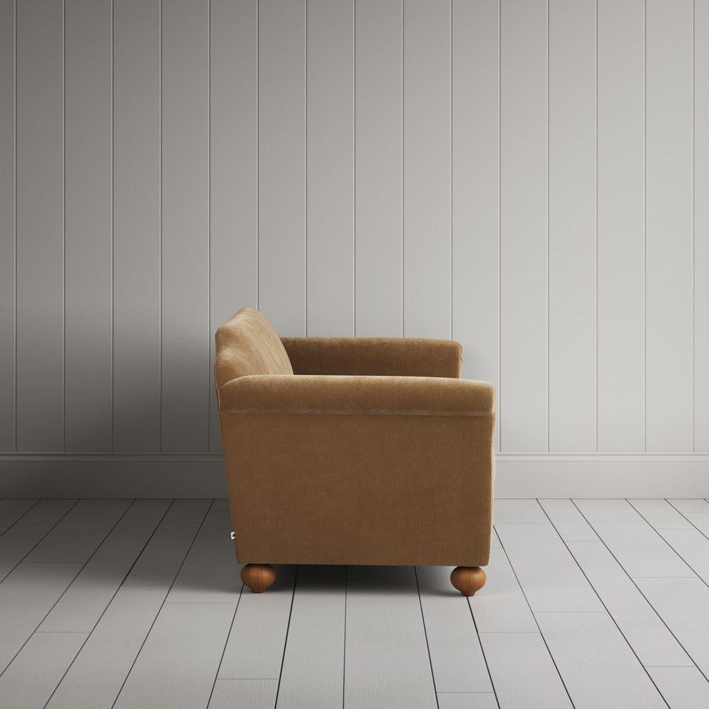 Side profile of the Stone Beige corduroy Dolittle sofa.