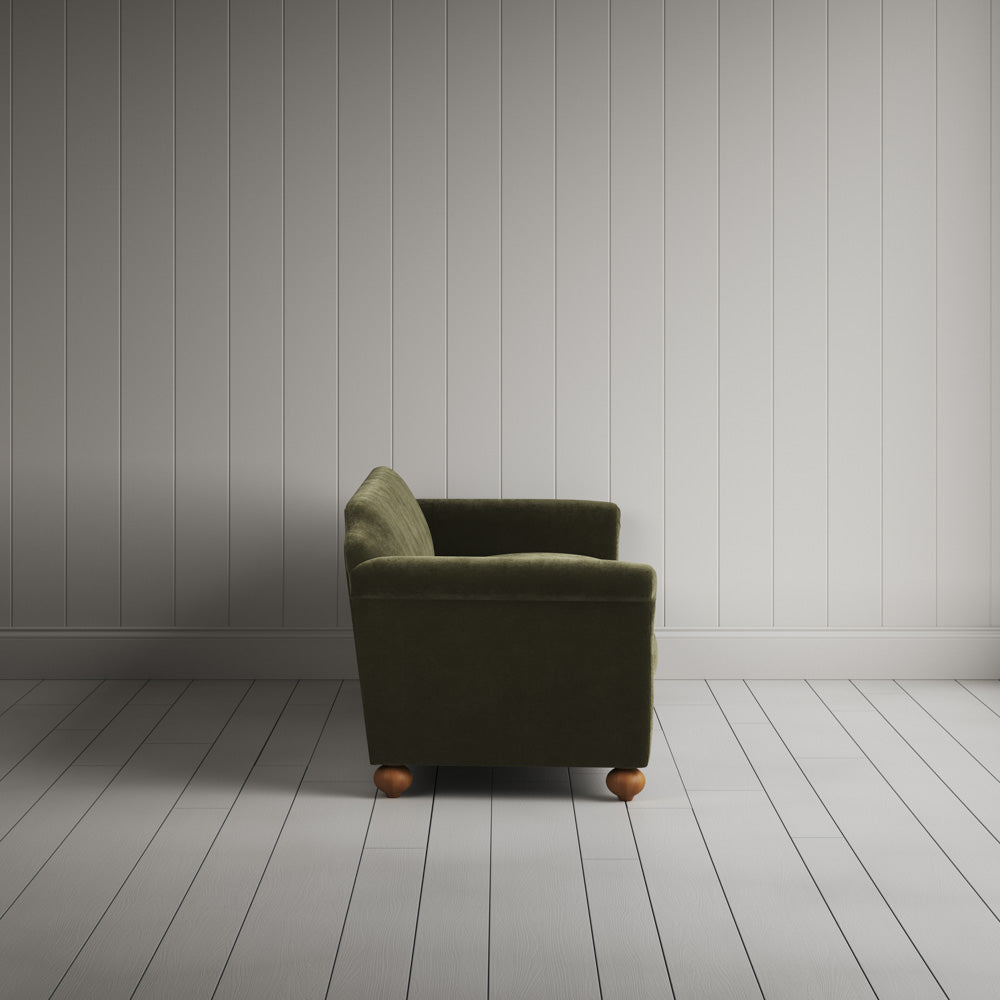 Side profile of the Caper green corduroy Dolittle sofa