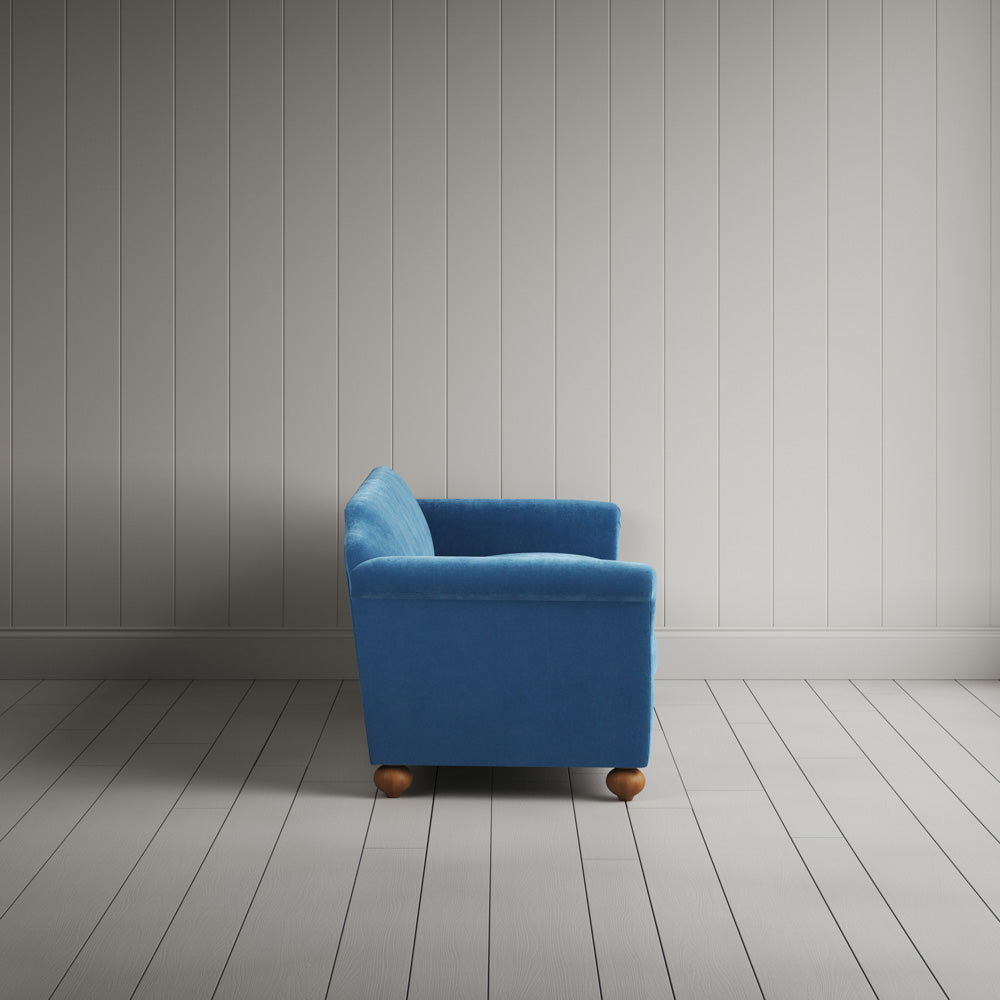 Side profile of the 4 seater Harbour Blue corduroy Dolittle sofa,