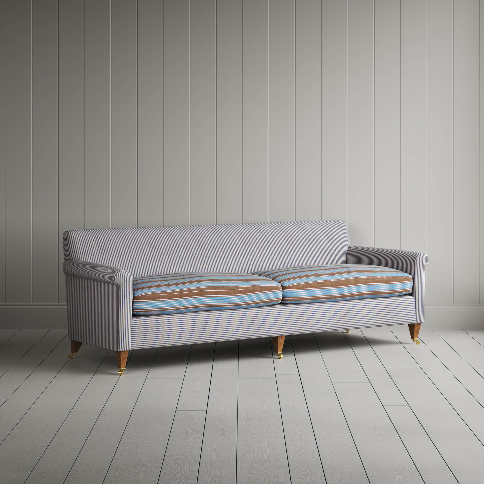 Angled view of the Ticking Blue Brown Idler sofa by NiX