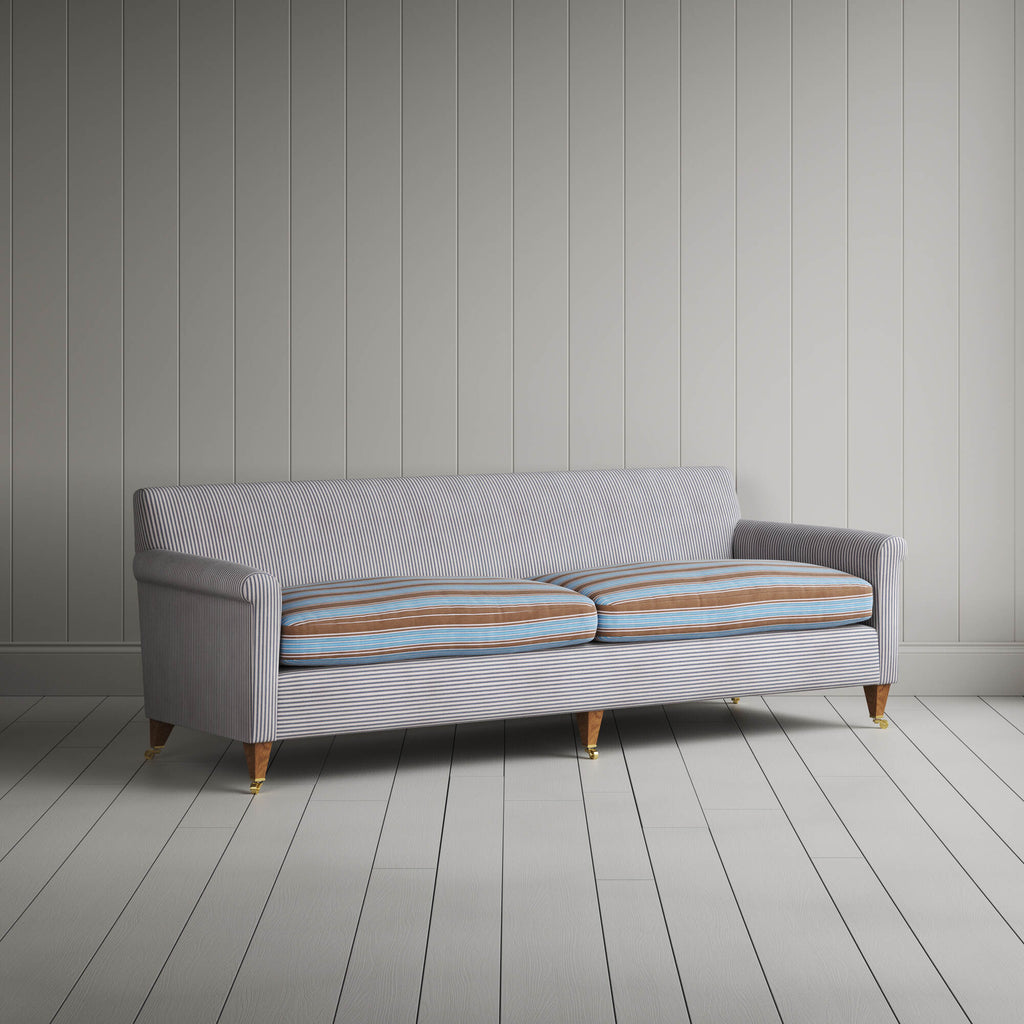 Angled view of the Ticking Blue Brown Idler sofa by NiX