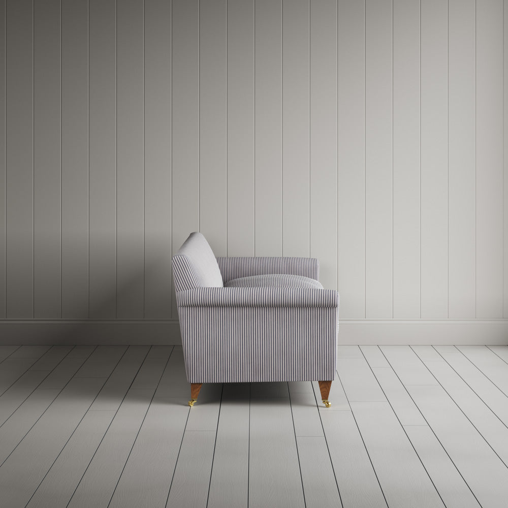 Side profile of the striped Idler sofa by Nicola Harding