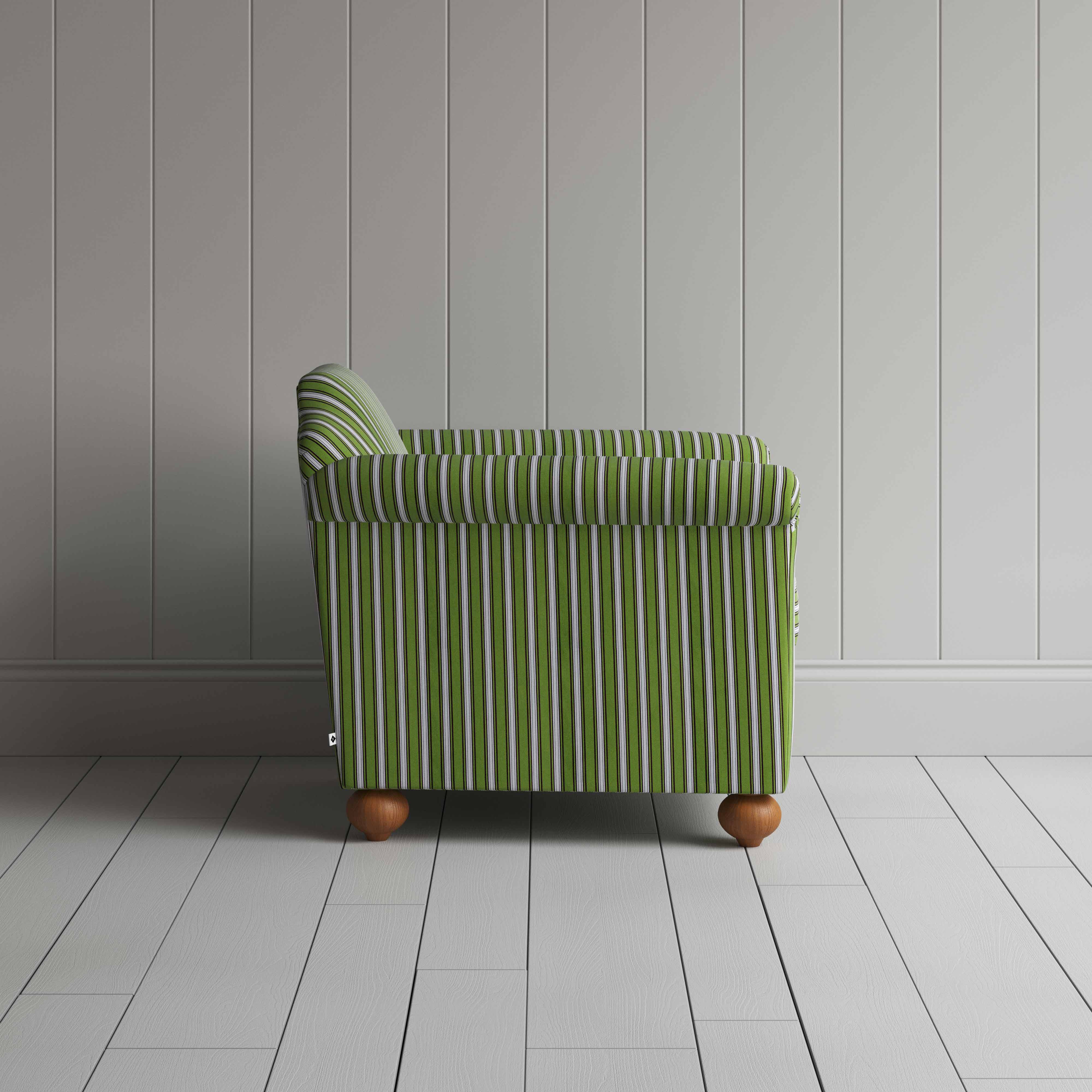 Green and white striped sofa against a wall.