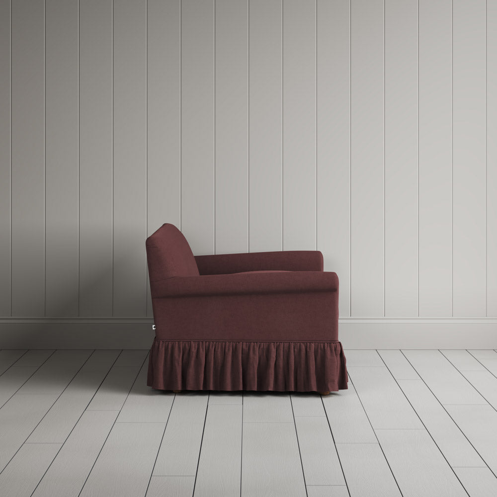 Side profile of a luxury Damson linen love seat by Nicola Harding