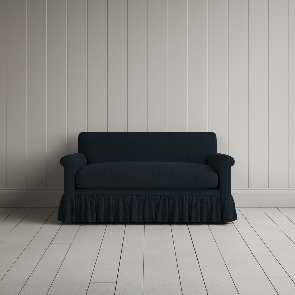 Front portrait of the Laidback Linen Curtain Call love seat by Nicola Harding interiors.