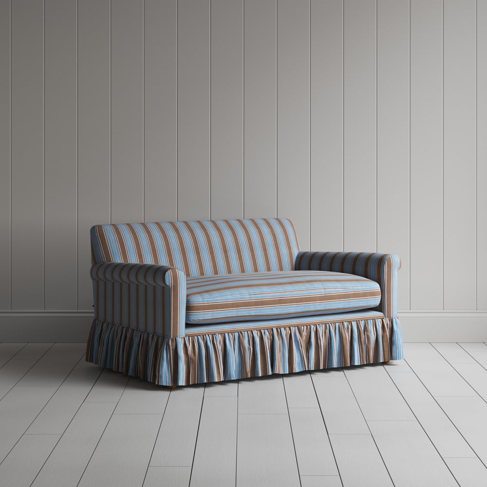 Three-quarter view of the Regatta Cotton Blue Curtain Call love seat by NiX.