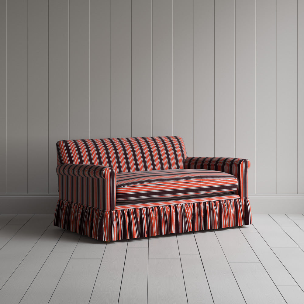 Angled shot of a vibrant flame orange cotton upholstered love seats variant by Nicola Harding.