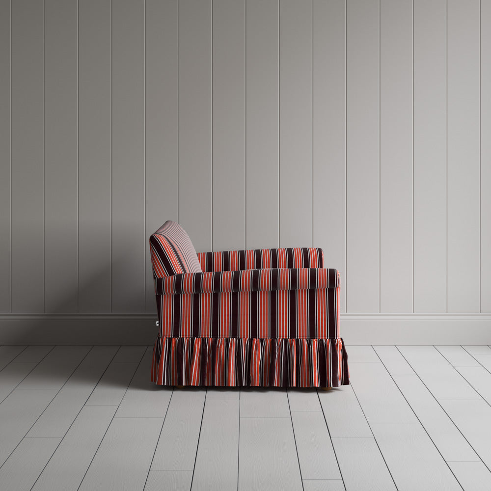 Compact side profile of a luxury flame colored cotton love seat by Nicola Harding.