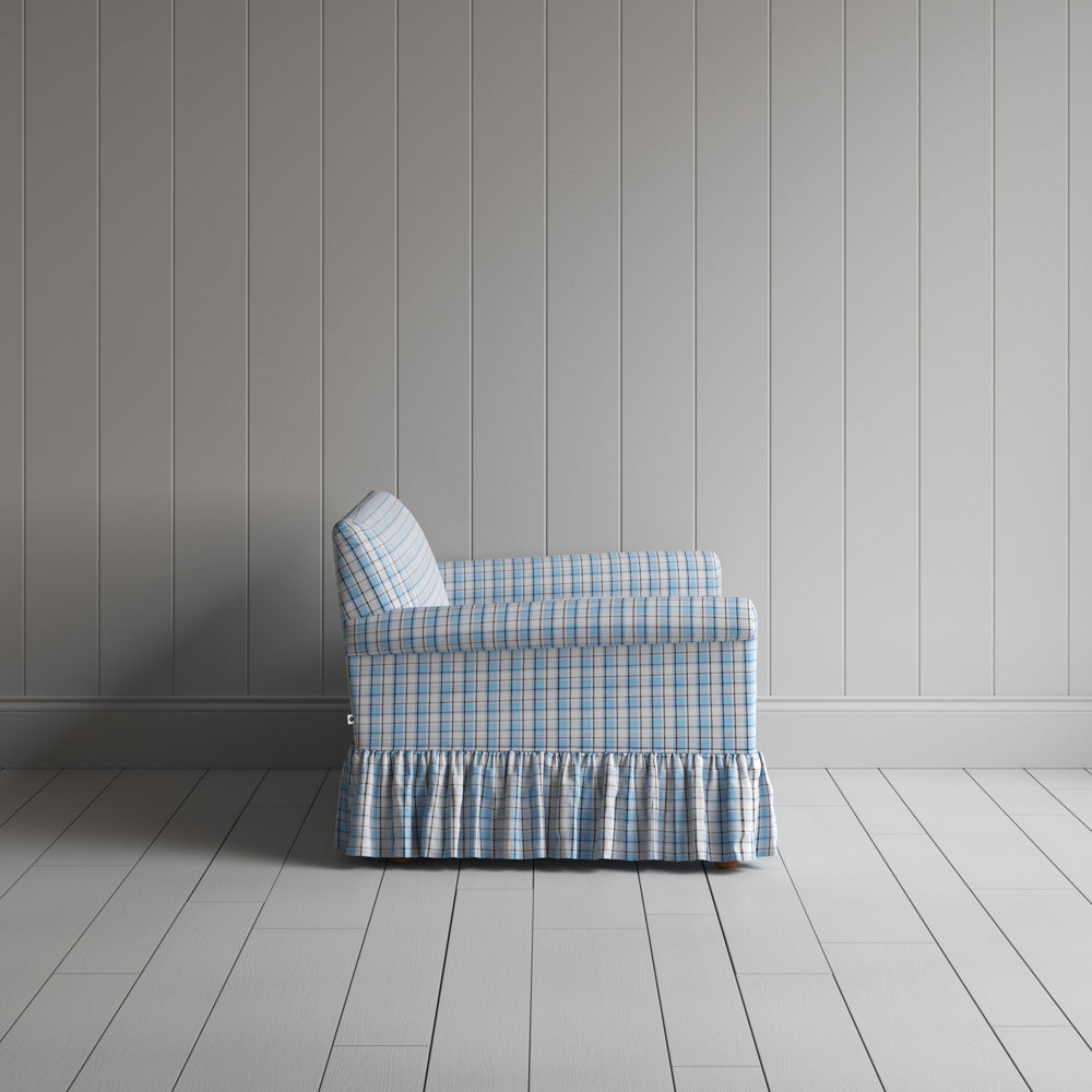 Side profile of a luxury patterned cotton love seat by Nicola Harding.