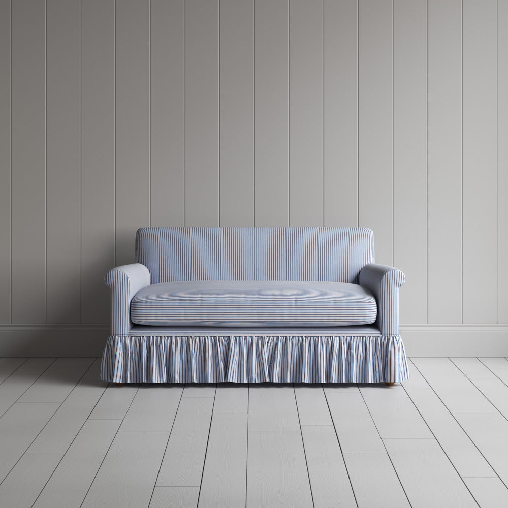 Front view of the Ticking Cotton Curtain Call love seat by Nicola Harding interiors.