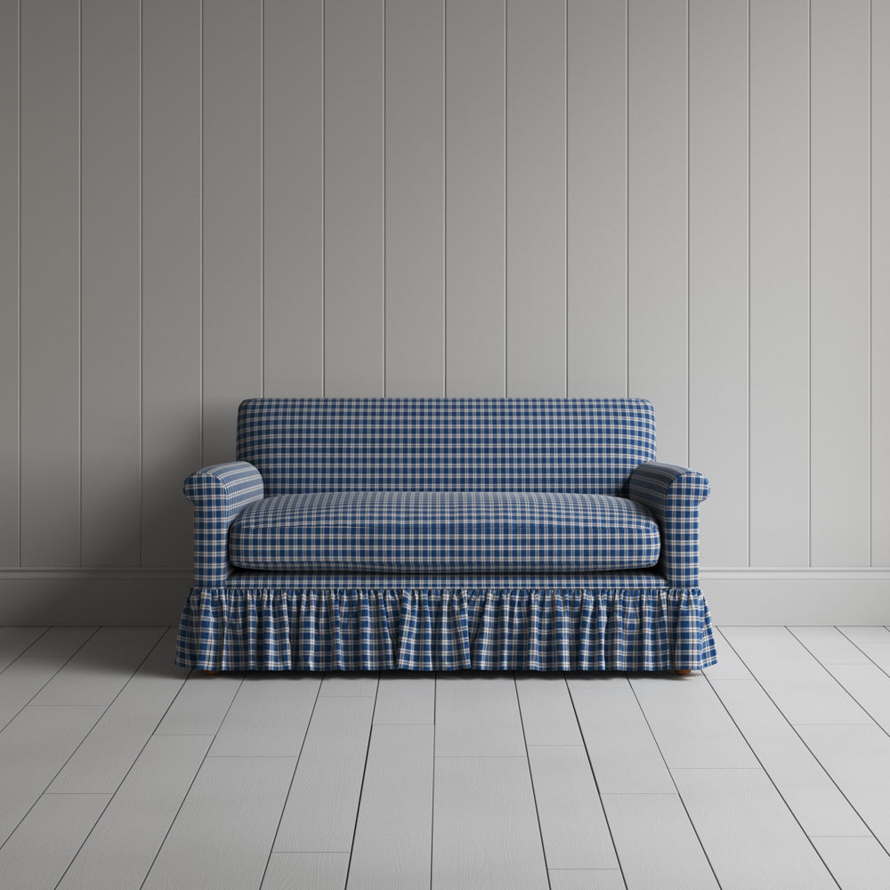 Front shot of the Well Plaid Cotton Curtain Call love seat by Nicola Harding interiors.