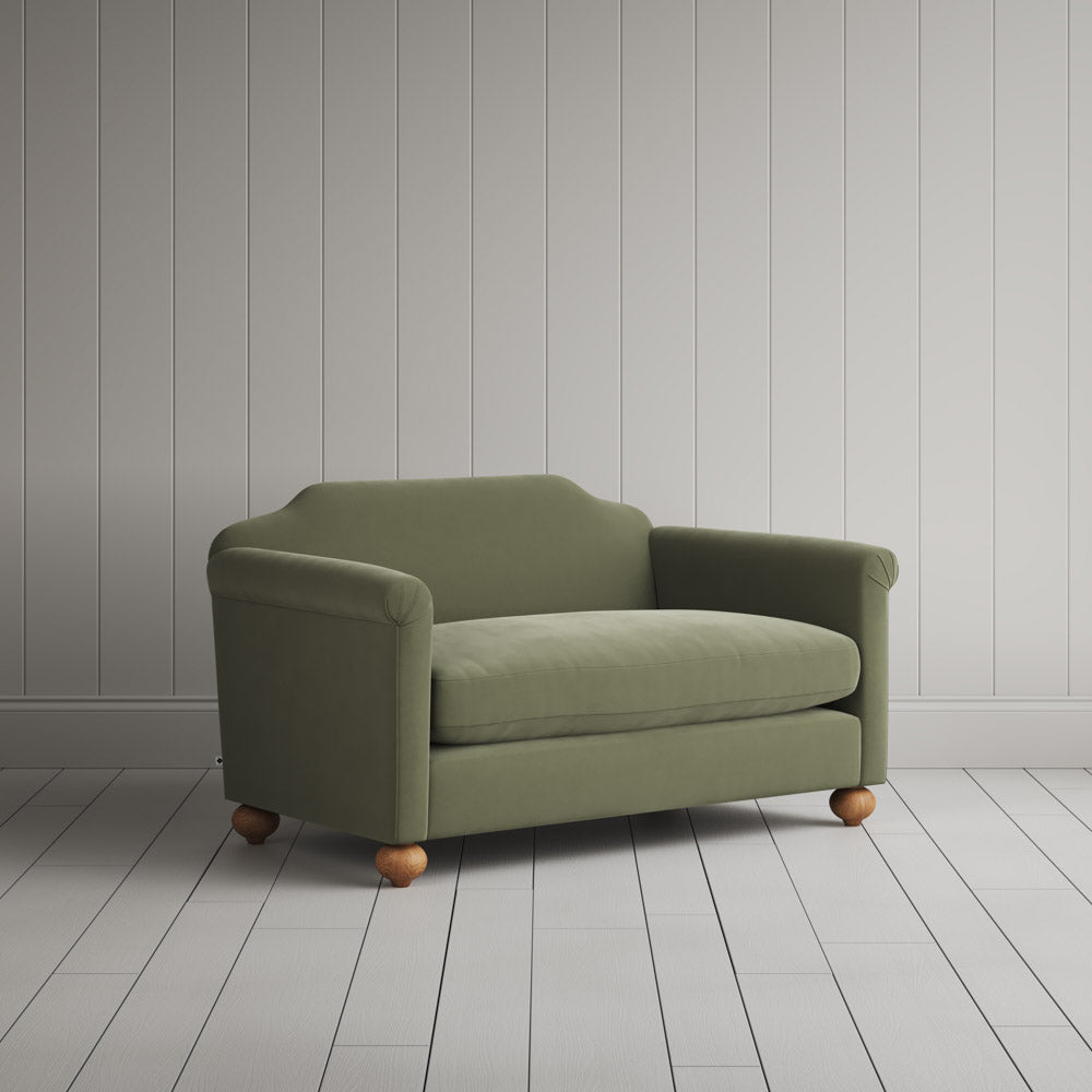 Three-quarter view of the light green velvet Dolittle love seat by NiX.