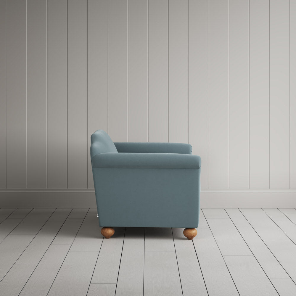 Side view showing the arched back profile of the NiX interiors Dolittle sofa.