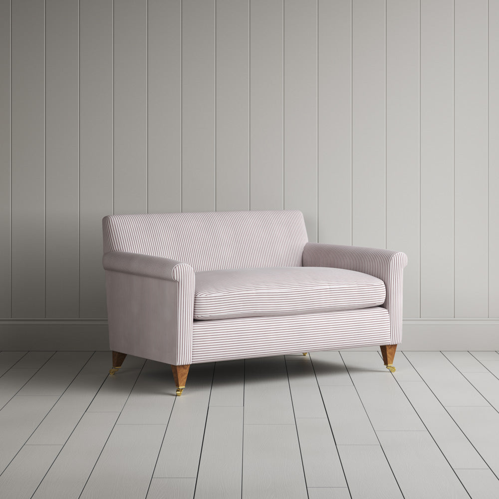 Elegant angled view of the Idler BIG LOVE seat in Berry stripes, designed for luxury interior settings by Nicola Harding.