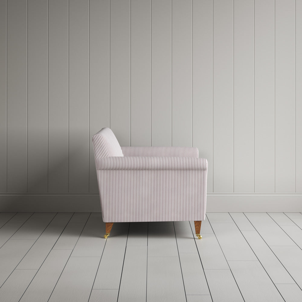 Side profile of the Berry ticking love seat revealing its sturdy handcrafted beech frame and timeless lines by Nix.