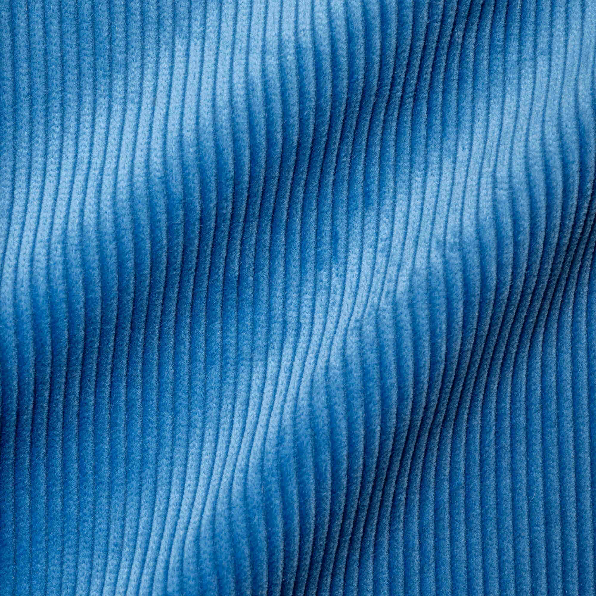 Flat lay of Harbour Blue Classic Corduroy, a rich navy ribbed fabric for luxury seating.