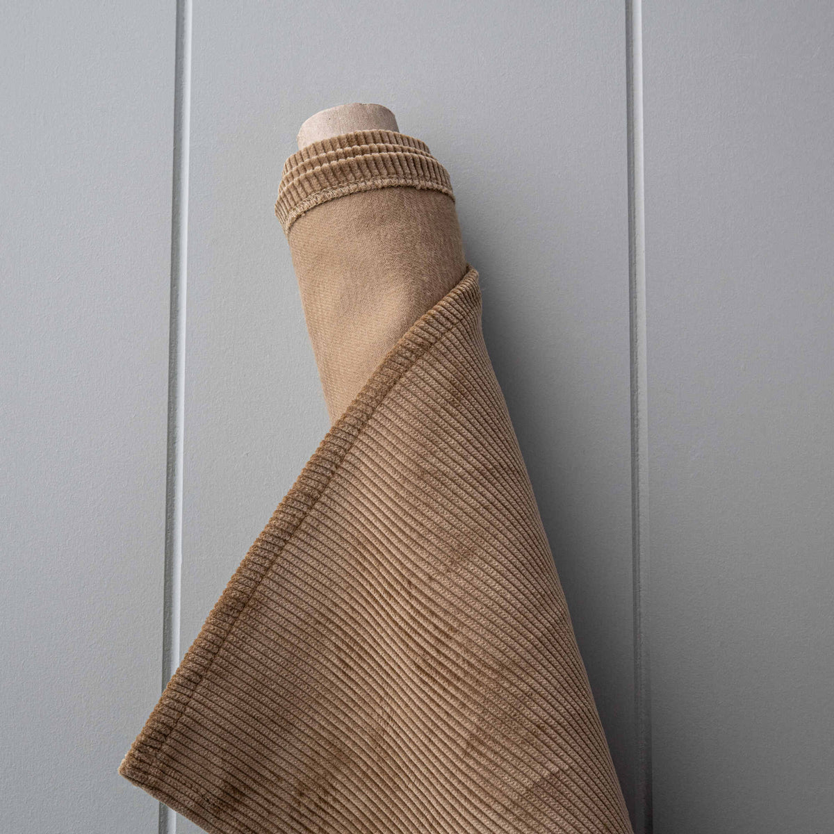 Roll of Stone Beige Classic Corduroy fabric for bespoke Nicola Harding upholstery.