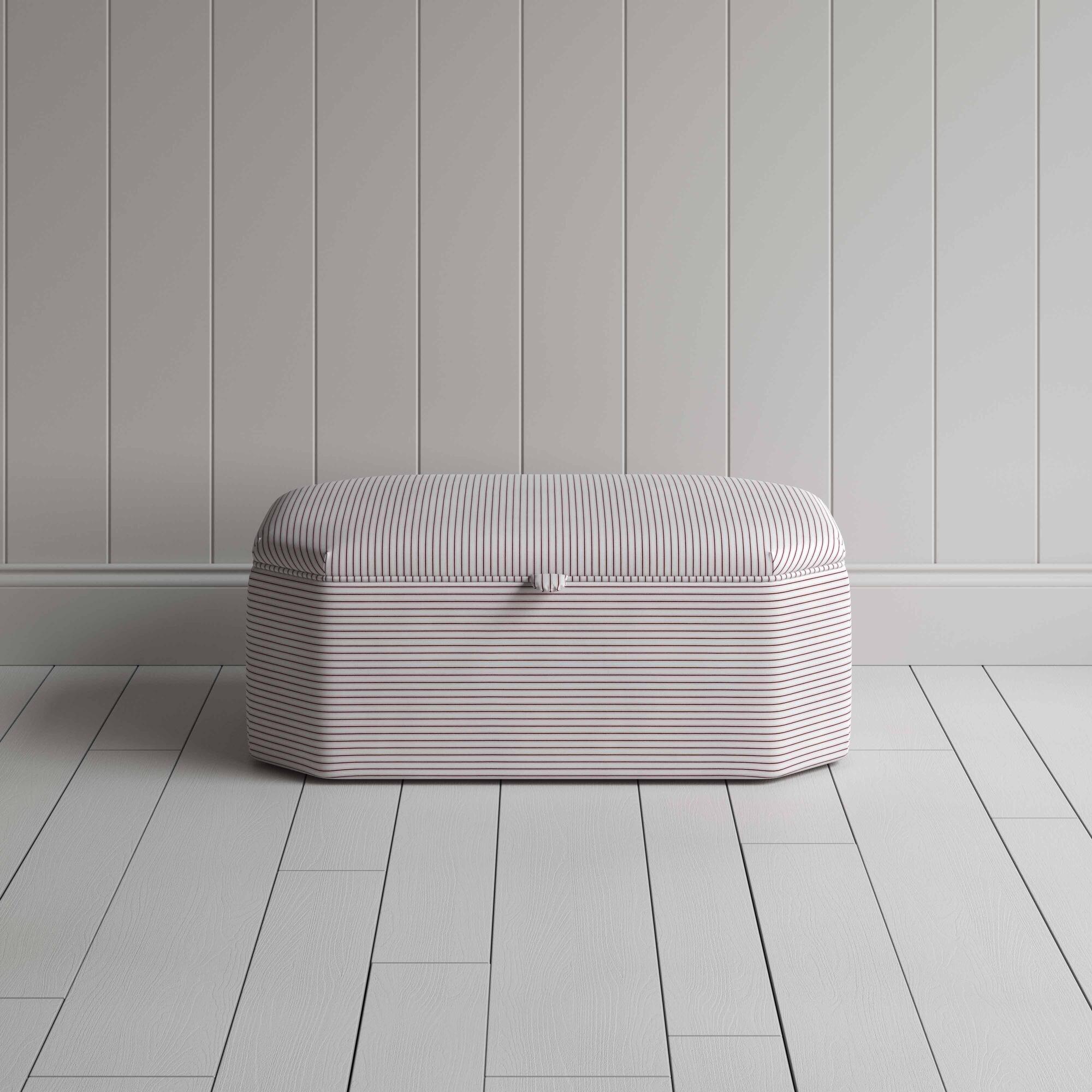 Stylish striped ottoman against white flooring. Front View - NiX