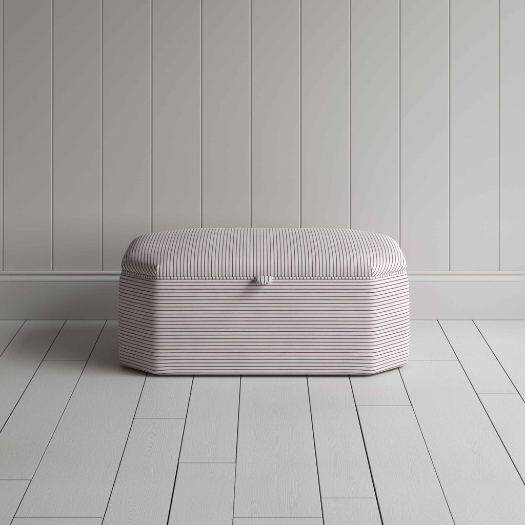 Stylish striped ottoman against white flooring. Front View - NiX