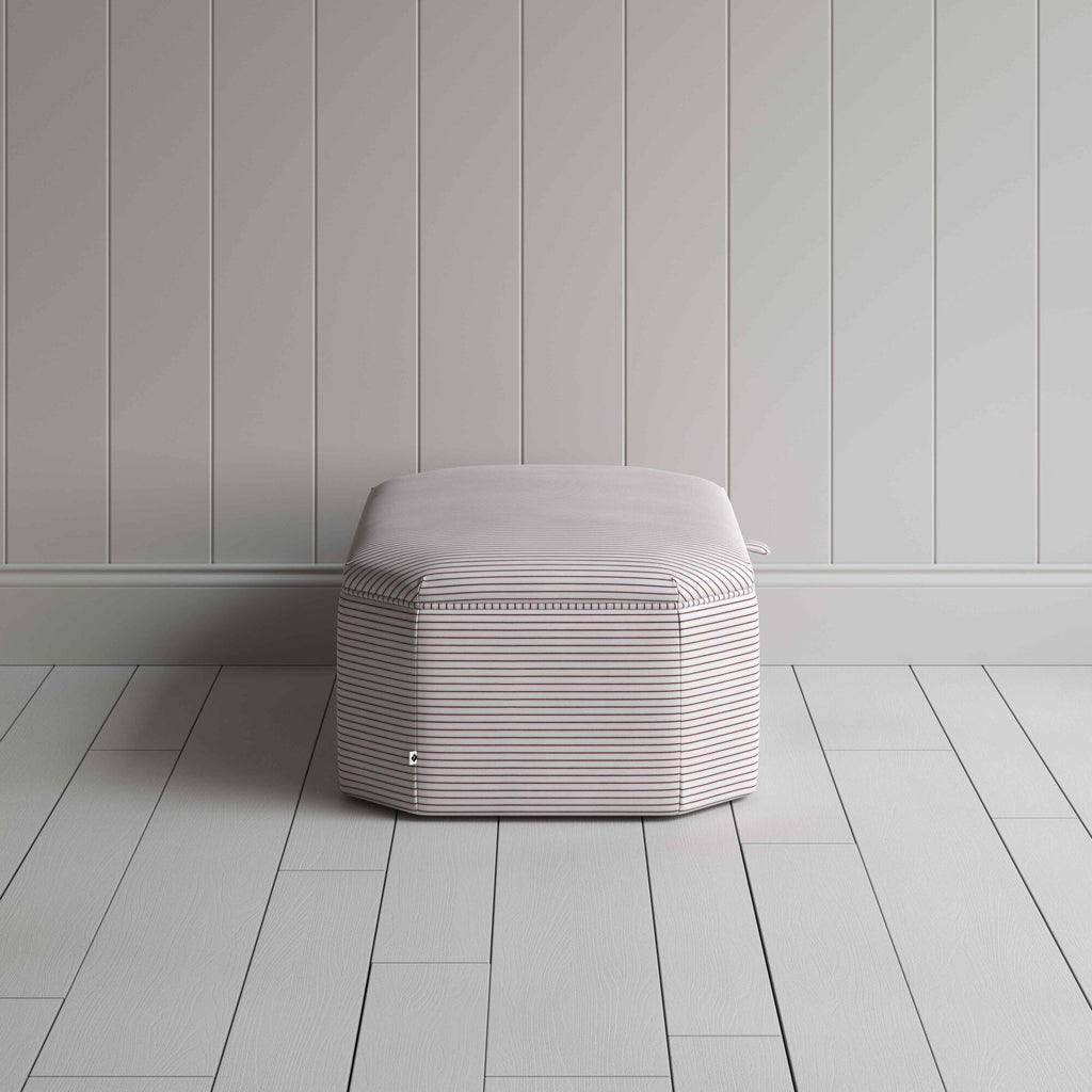 Stylish striped ottoman against white flooring. Side View - NiX