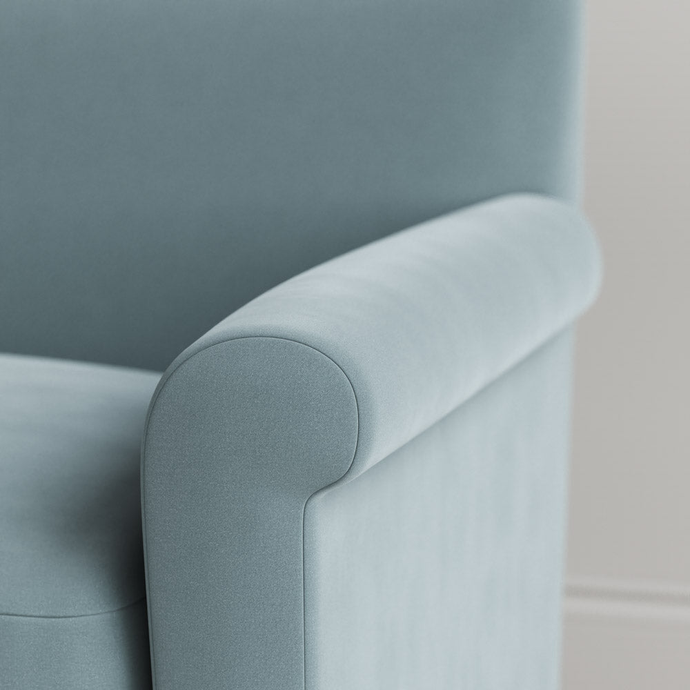 Close-up of Velvet Mineral love seat armrest by Nicola Harding