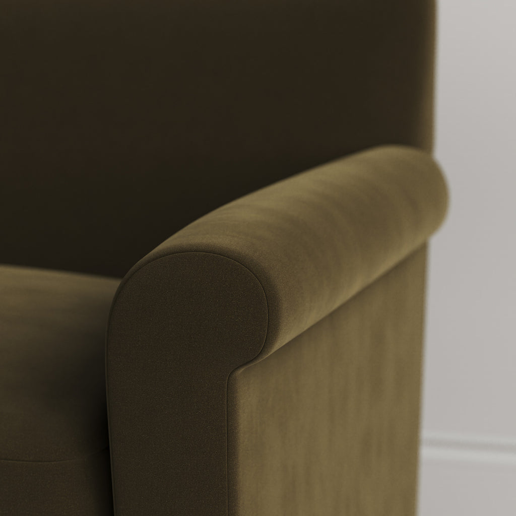 Close-up of the tailored armrest on the Seaweed velvet Idler by Nix.