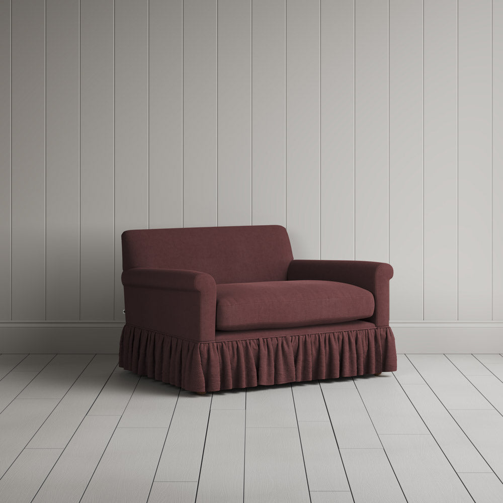 Curtain Call Love Seat skirted small sofa in laidback linen damson, angled view by NiX.