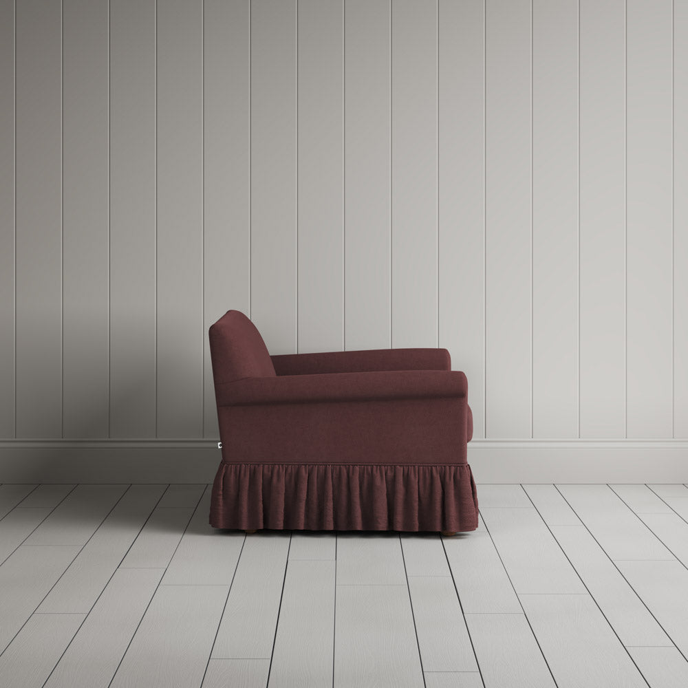 Curtain Call Love Seat in laidback linen damson, side profile view showing silhouette.
