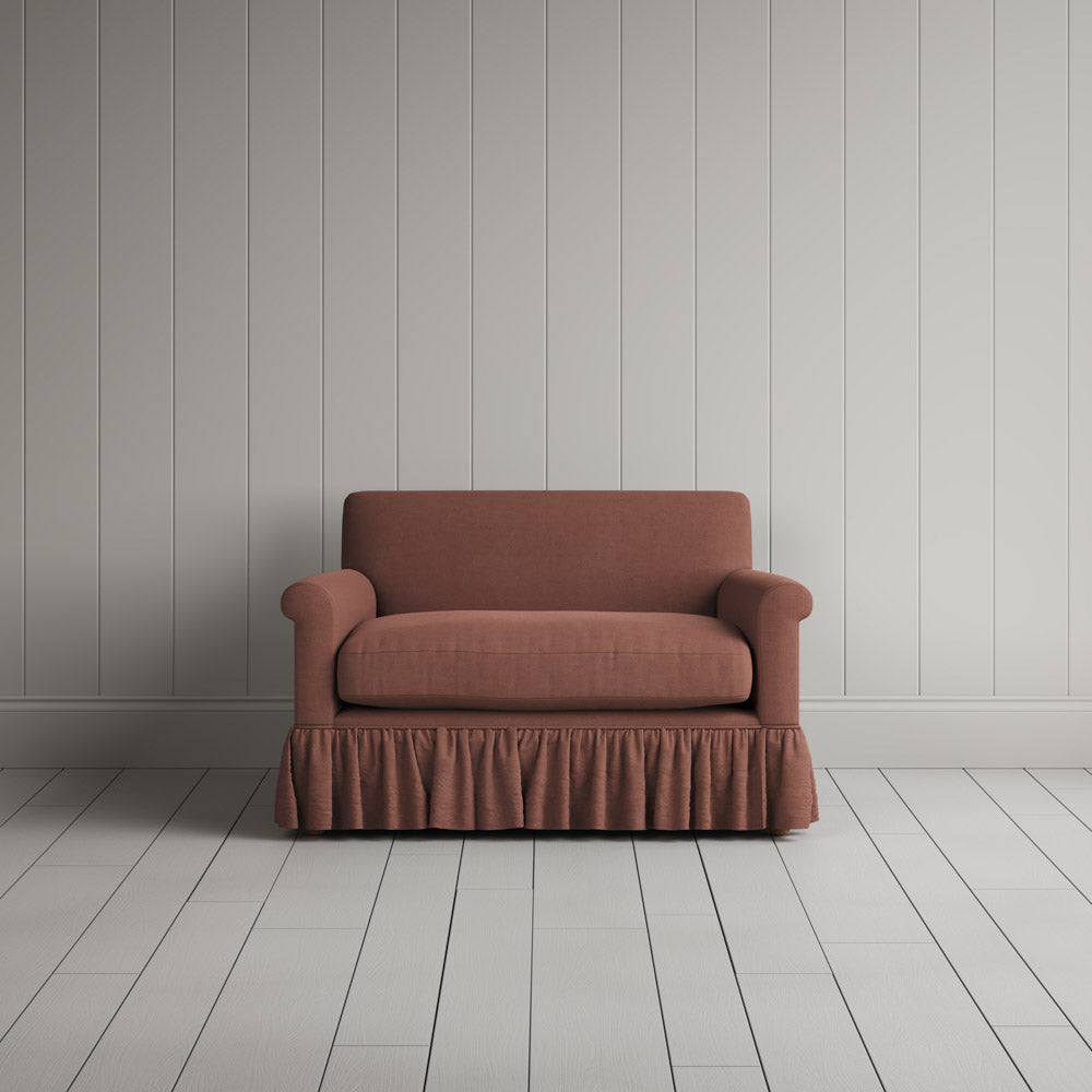 NiX furniture compact sweet briar soft pink linen sofa with gathered valance skirt, front view.