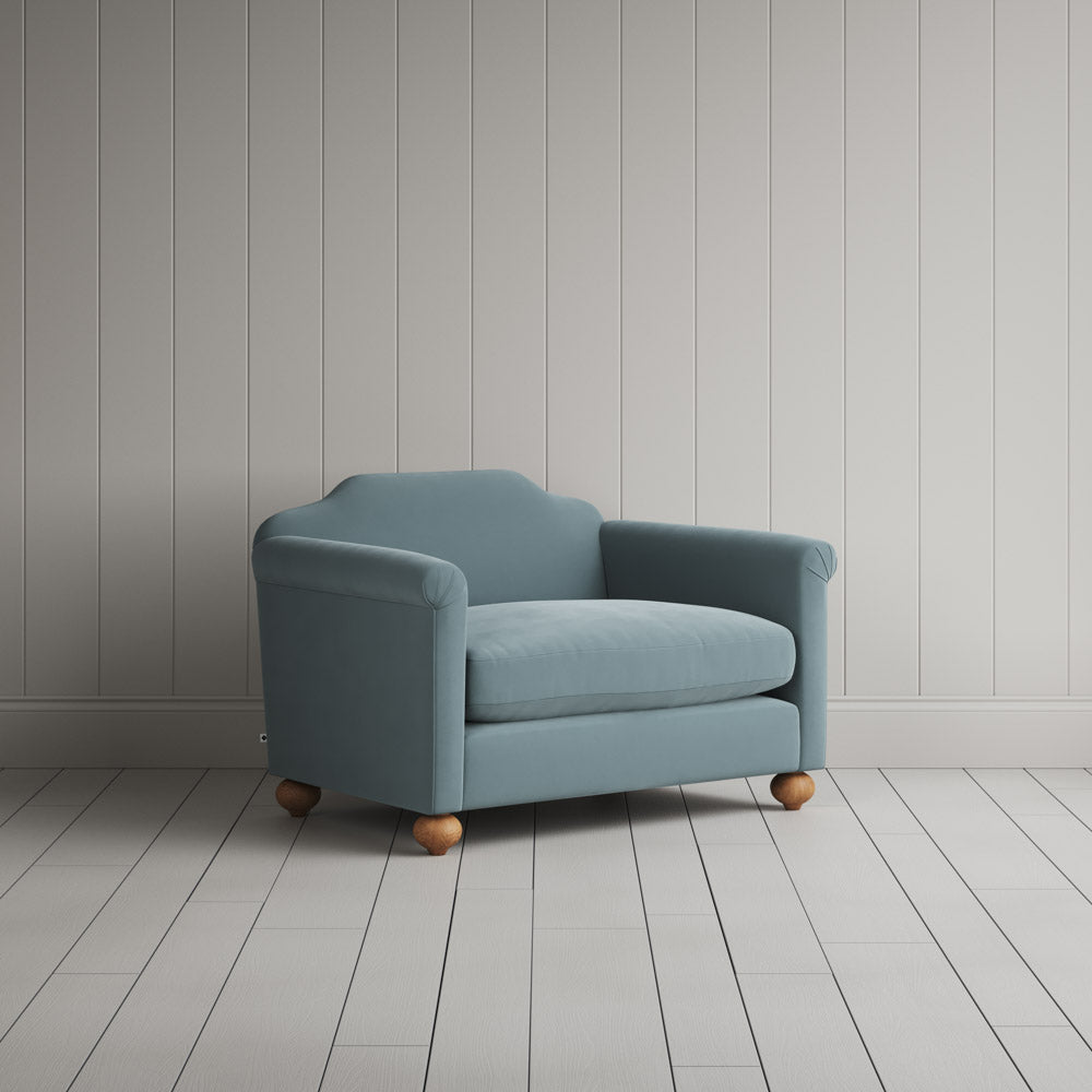 Nicola Harding interiors Art Deco inspired love seat, angled studio view.
