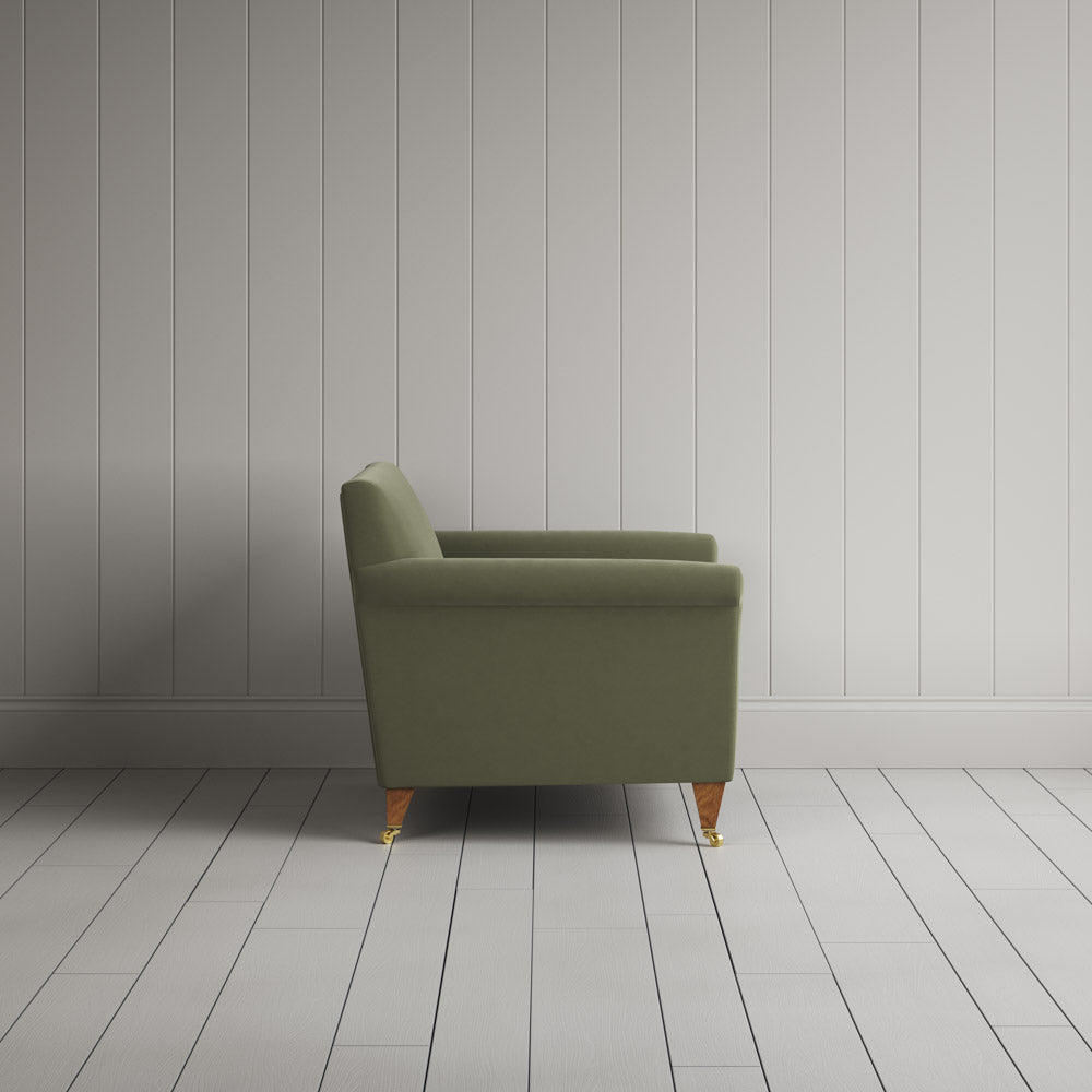 Side profile of Idler Love Seat in Intelligent Velvet Green Tea