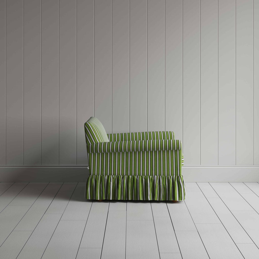 Green and white striped sofa adding an element to room.