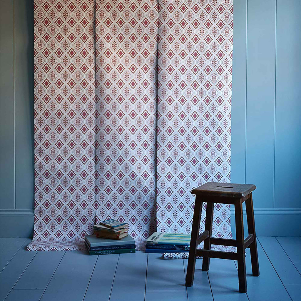 Showcasing the Rhombus wallpaper in Rhubarb and Pink, designed by NiX (By Nicola Harding & Co.), adding a bold and vibrant touch.