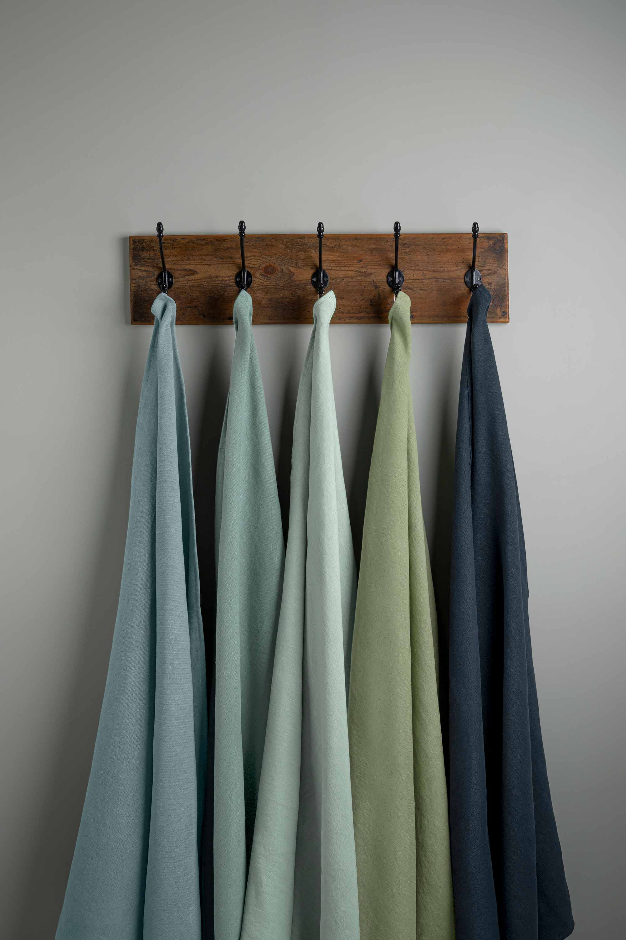 Linen Fabric Swatches in Different Colors Hanging on Hooks – By NiX