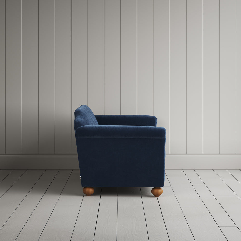 Side profile of the dark blue corduroy Dolittle sofa - NiX