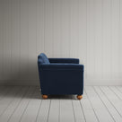 Side profile of the dark blue corduroy Dolittle sofa - NiX