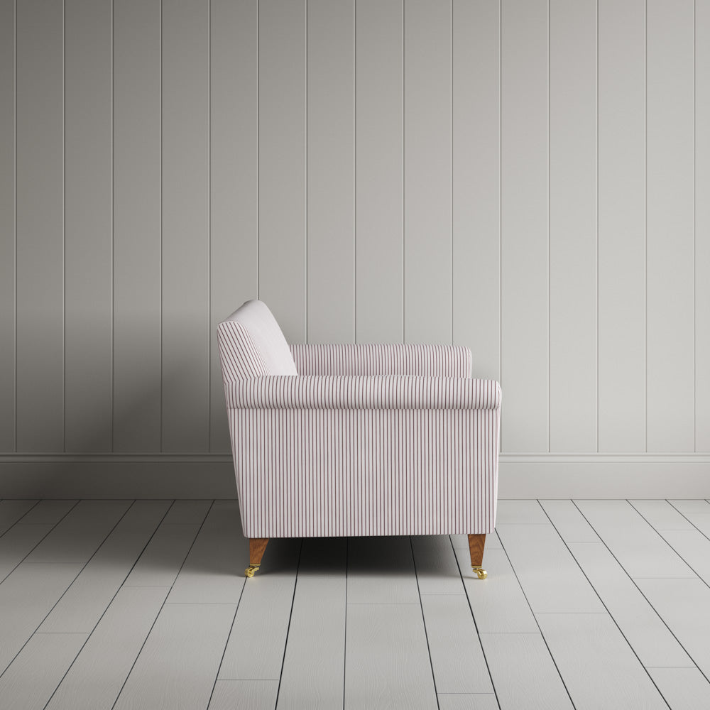  Side profile of the striped Idler sofa by NiX 