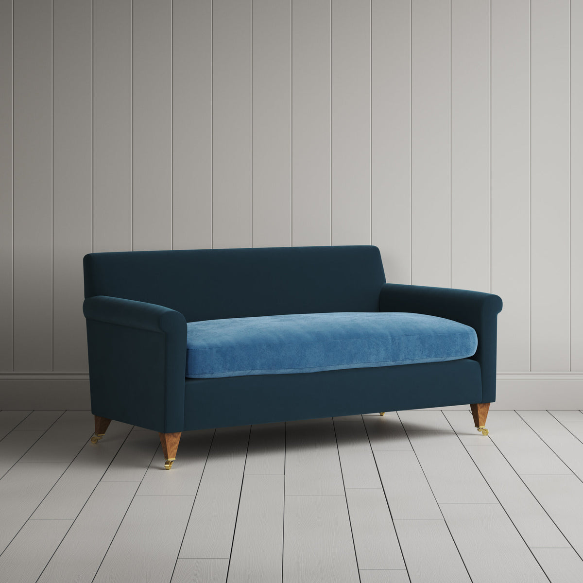 Angled view of the Velvet Aegean Idler sofa by NiX