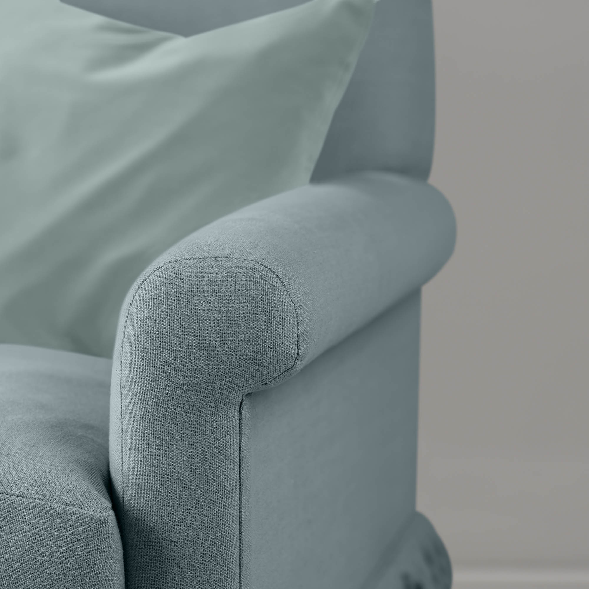  Curtain Call cerulean linen love seat styled with cushion, Nicola Harding & Co 
