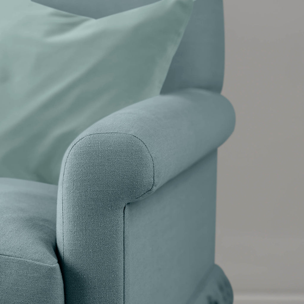  Curtain Call cerulean linen love seat styled with cushion, Nicola Harding & Co 