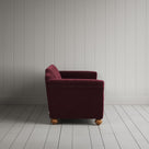 Side profile of the Cherry red corduroy Dolittle sofa