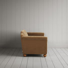 Side profile of the Stone Beige corduroy Dolittle sofa.