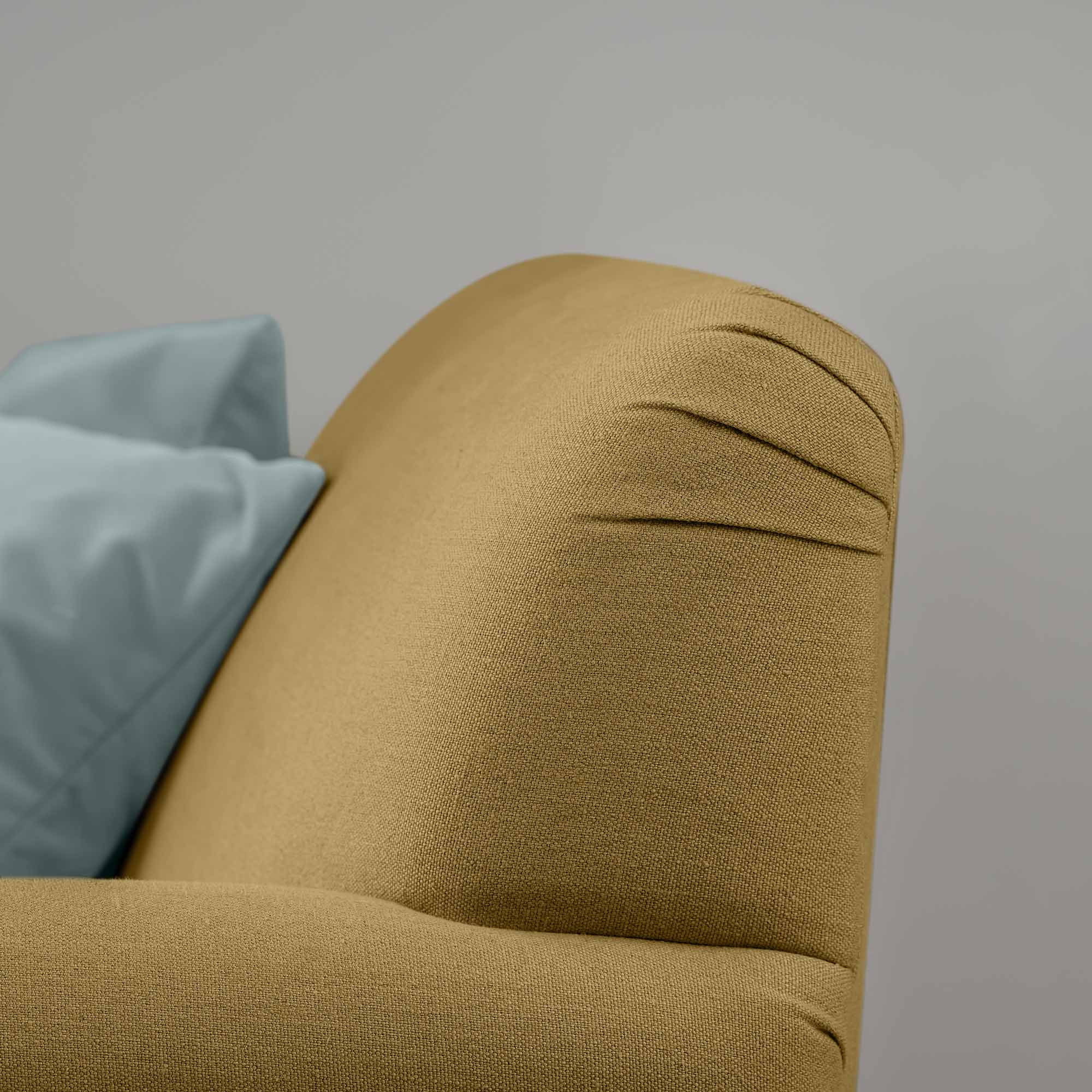  Curtain Call Love Seat close-up detail of the rounded backrest corner in laidback linen ochre. 