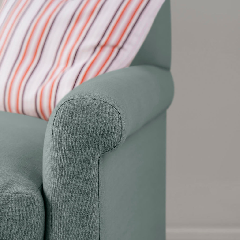  Closeup view of Mineral linen upholstery on the armrest by Nicola Harding. 