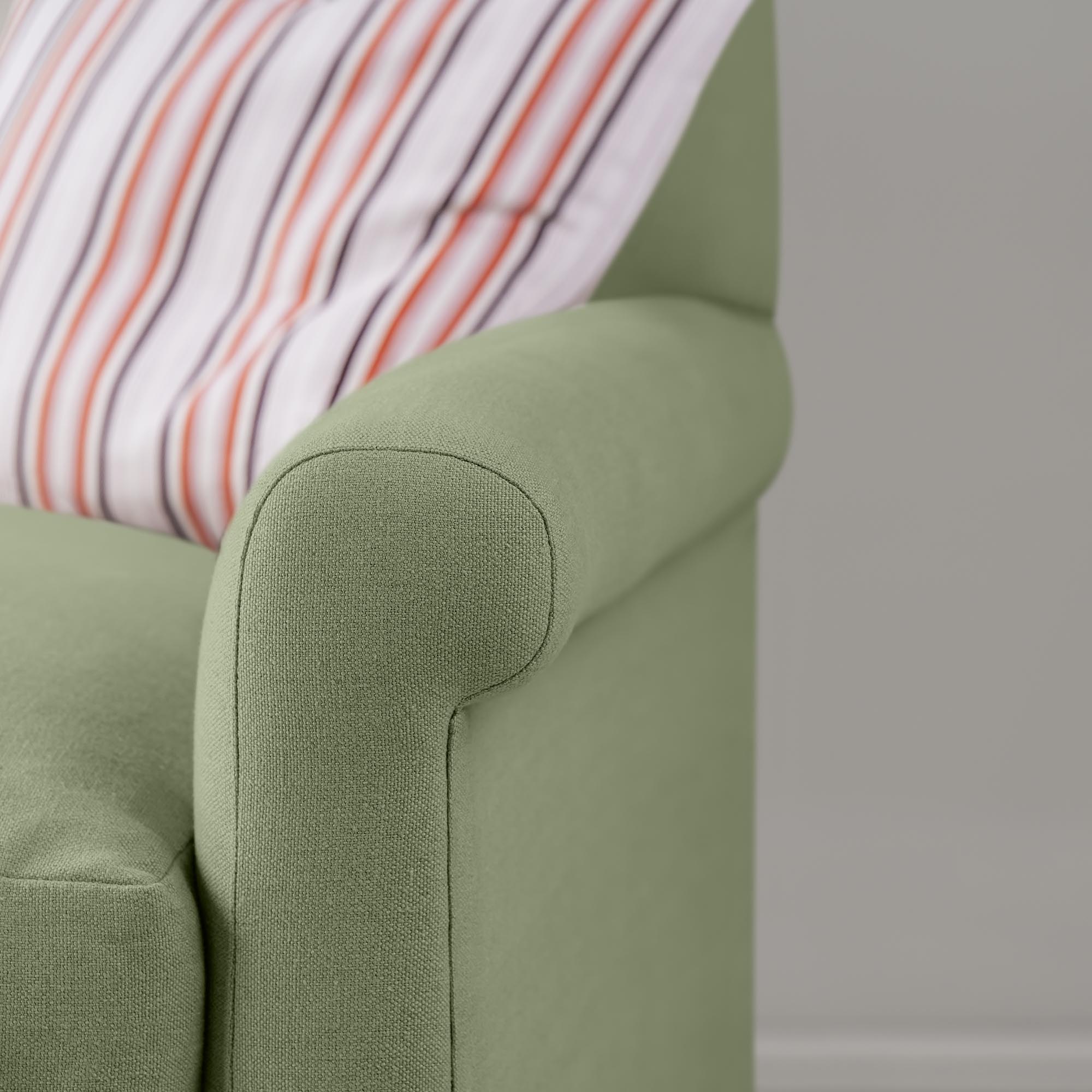  Detailed view of Moss green linen upholstery on the armrest by Nicola Harding. 