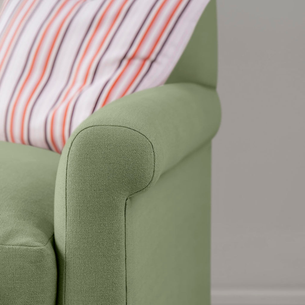  Detailed view of Moss green linen upholstery on the armrest by Nicola Harding. 