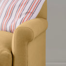 Detailed view of Ochre linen upholstery on the armrest by Nicola Harding.