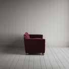 Side profile of the Cherry red corduroy Dolittle sofa