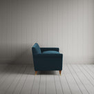 Side profile of the Velvet Aegean Idler sofa by Nicola Harding